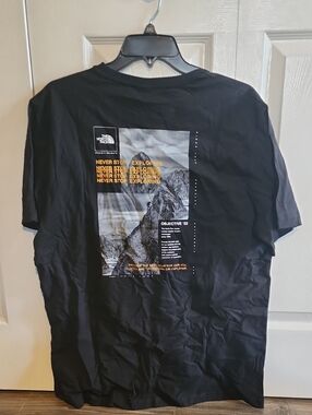 The North Face Men’s Black Short Sleeve Graphic Tee with Yellow Accent
